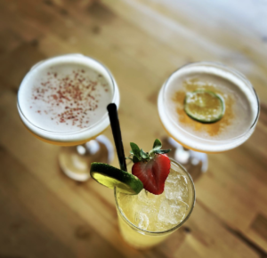 aerial view of three cocktails sitting on a table