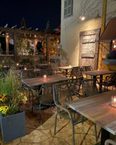 outdoor patio area of Latin King with cozy lighting